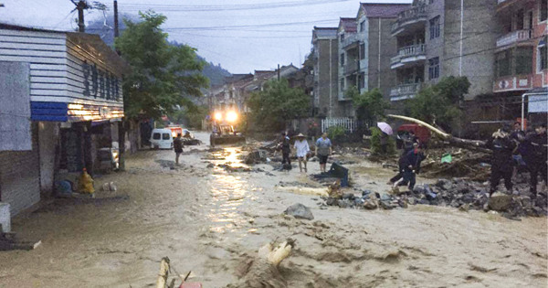Landslides and disruption as heavy rain hits E. China