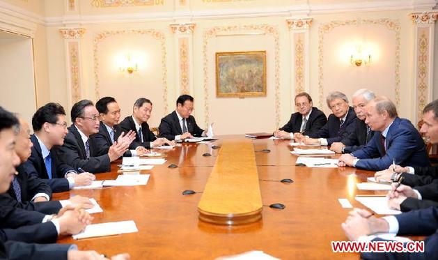 Wu Bangguo, chairman of the Standing Committee of the National People's Congress of China, meets with Russian Prime Minister Vladimir Putin in Moscow, capital of Russia, Sept. 14, 2011. China's top legislator Wu Bangguo arrived here on Wednesday for an official goodwill visit. Wu will also attend the fifth meeting of the China-Russia parliamentary cooperation committee, the highest-level regular meeting mechanism between China's top legislature and a foreign parliament. (Xinhua/Xie Huanchi) 