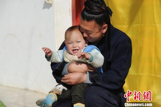 Wei and the baby boy who is already one year old
