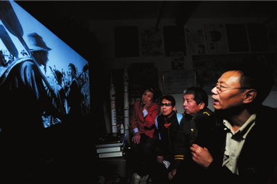 Wang Weili, man runs the cinema in own house, volunteers as film narrator for his blind audiences.