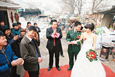 The couple is having the wedding ceremony in the garbage recollecting station.
