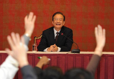 Chinese Premier Wen Jiabao attends a press conference in Doha, capital of Qatar, Jan. 18, 2012. 