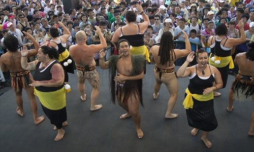 Maori performers from New Zealand show a traditional dance for visitors to the World Expo 2010 in Shanghai. [Photo: CFP]
