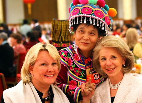 Zou Ping (center), a deputy of the National People's Congress, poses for a photo with Brigitta Backstrom (right), wife of the Finnish ambassador to China, and Paula Parviainen, deputy head of mission with the Finnish embassy in China, at the Great Hall of the People in Beijing on Wednesday. [Zou Hong / China Daily]