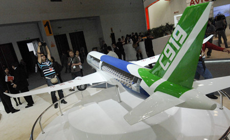 A model of the C919 commercial airliner made by the Commercial Aircraft Corporation of China is on display at the Aviation Expo in Beijing on Sept 21. [Zhang Yu / Xinhua]