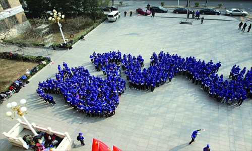 Beijing Mining and Technology University students (main, inset) celebrate World Water Day. [Photos: Courtesy of Thirst NGO 1]