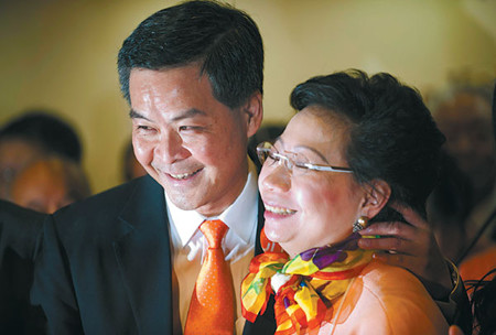 Former convener of Hong Kong's Executive Council Leung Chun-ying and his wife, Regina, celebrate his victory in the election for chief executive on Sunday. Associated Press
