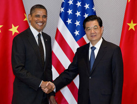 US President Barack Obama (L) shakes hands with Chinese President Hu Jintao during an expanded bilateral meeting before attending the 2012 Nuclear Security Summit in Seoul March 26, 2012. [Photo/Xinhua]