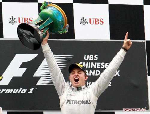 Mercedes-AMG driver Nico Rosberg of Germany celebrates after winning the Formula One's Chinese Grand Prix in Shanghai, China, April 15, 2012. (Xinhua/Fan Jun)