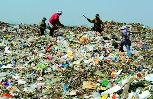 Farmers search for plastic bottles and other recyclable items this month on a 28-meter-high hill of garbage in Yuanfuzhuang, in Central China's Henan Province. Villagers earn about 1,500 yuan ($240) a month selling the reclaimed materials, which is their only source of income. There is little farmland to support families because the local government claimed much of it to enlarge the landfill. Photos by Xiang Mingchao / China Daily
