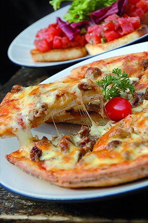 East meets West on the pizzas at Pass By Bar. [Photo: Courtesy of Pass By Bar]