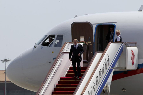 ian President Vladimir Putin gets off a plane after arriving in Beijing, capital of China, June 5, 2012, kicking off a three-day state visit to China. During the visit, Putin will attend the 12th Meeting of the Council of Heads of Member States of the Shanghai Cooperation Organization (SCO) in Beijing on June 6-7. (Xinhua/Ding Lin)