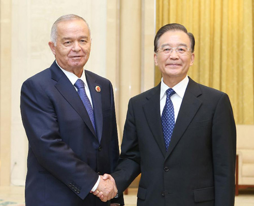 Chinese Premier Wen Jiabao (R) meets with Uzbek President Islam Karimov at the Great Hall of the People in Beijing, capital of China, June 6, 2012. Karimov arrived in Beijing on Tuesday evening to visit China and attend the 12th Meeting of the Council of Heads of Member States of the Shanghai Cooperation Organization (SCO) on Wednesday and Thursday. (Xinhua/Yao Dawei)