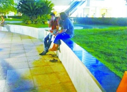 In Ningbo, two male foreigners were caught spitting sunflower seed shells on a sidewalk on May 29, 2012. 