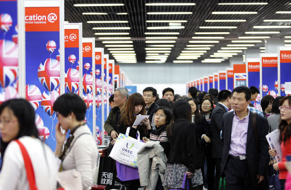 Visitors check out the UK booth at the 17th China International Education Exhibition Tour in Beijing this March. Hundreds of education institutions from more than 30 countries and regions participated in the exhibition in the hope of enrolling more Chinese students. Luo Wei / Xinhua