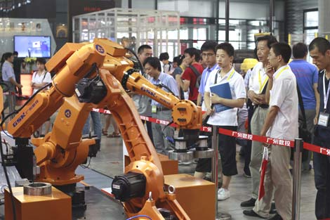 An industrial robot on display at the 2012 China Robot Industry Promotion Conference, which opened on July 3, 2012, in Shanghai. [Photo / China Daily] 