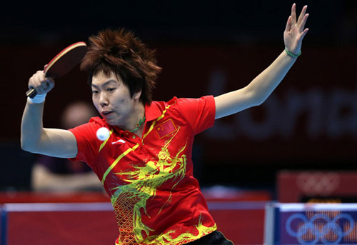 China's Li Xiaoxia performs at the women's singles table tennis tournament finals against China's Ding Ning at the ExCel venue during the London 2012 Olympic Games August 1, 2012. [Photo / Xinhua]  