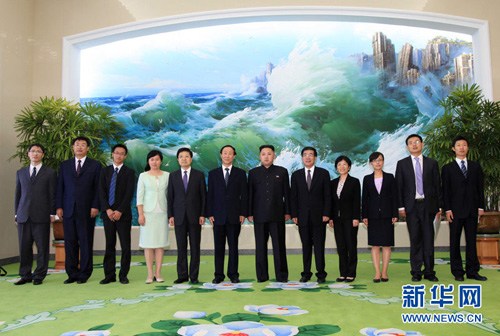 Top leader of the Democratic People's Republic of Korea (DPRK) Kim Jong Un (6th R) poses for a group photo with a Chinese delegation led by Wang Jiarui (6th L), head of the International Department of the Communist Party of China (CPC) Central Committee, 
