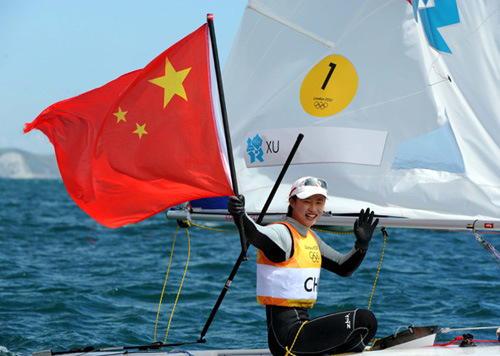 China's Xu Lijia celebrates after winning women's laser radial race of sailing event, at London 2012 Olympic Games, London, Britain, Aug. 6, 2012. China's Xu Lijia won gold medal. (Xinhua/Gong Lei) 