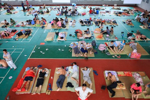 A gym provides temporary accommodation for dozens of people in Hangzhou, Zhejiang province, on Wednesday as Typhoon Haikui bears down.