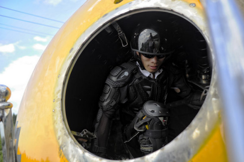 Yang Zongfu prepares for a performance test of Noah's Ark that will tumble into water from a 50-meter high hillside in Yiwu county, East China's Zhejiang province, Aug 6, 2012.