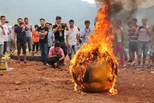 The Noah's Ark is set alight to test its performance in high temperatures in Yiwu county, East China's Zhejiang province, Aug 6, 2012.