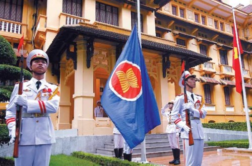 Honor guards raise the Association of Southeast Asian Nations flag at a flag raising ceremony to mark the 45th anniversary of the regional group at Vietnam's Ministry of Foreign Aff airs in Hanoi, Vietnam, on Wednesday.
