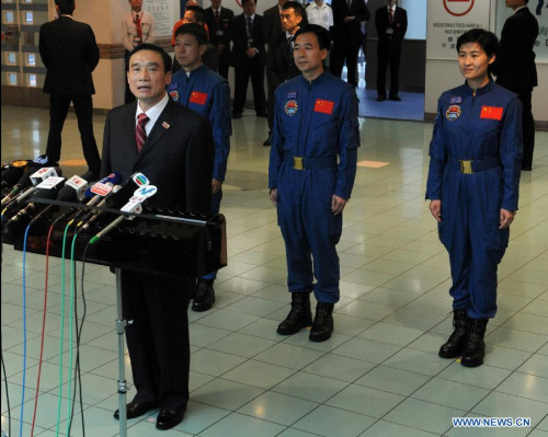 Niu Hongguang (front), deputy commander-in-chief of manned space program, and Shenzhou-9 astronauts Jing Haipeng (C, back), Liu Wang (L, back) and Liu Yang (R, back) meet with media before leaving for Macao in Hong Kong, south China, Aug. 13, 2012. The Tiangong-1/Shenzhou-9 delegation concluded their visit in Hong Kong and set for Macao for another visit. (Xinhua/Liao Zida)
