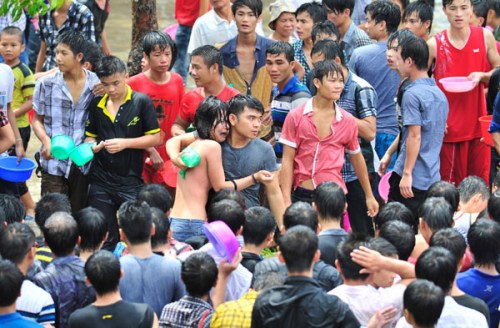 A woman is comforted by her friend after she was allegedly sexually assaulted on Thursday during events to mark a local water festival in the Baoting Li and Miao autonomous county, Hainan province. Provided to China Daily