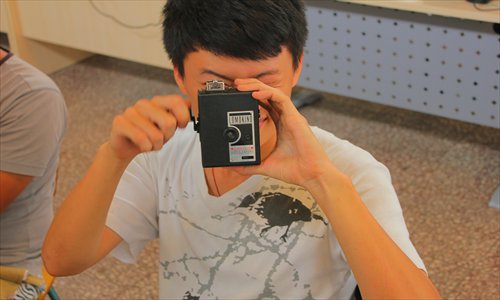 A student at the workshop practices using a Lomo camera. Photo: Courtesy of Luma Lu Studio 
