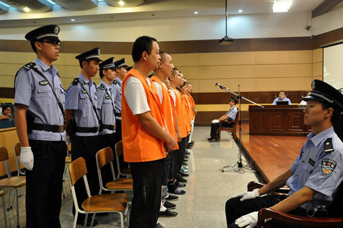 People accused of being involved in a gutter oil selling case stand trial on Tuesday in Ningbo, Zhejiang province. Provided by Ningbo Intermediate People's Court