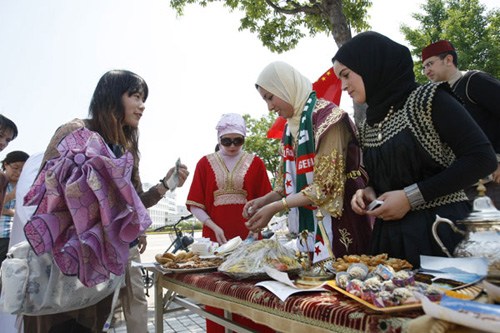 Overseas students show their locally flavored food at an international cultural festival in Shanghai University. Shi Peiqi / for China Daily