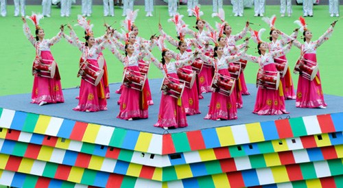 Dancers perform a traditional folk dance of the Korean ethnic group during a gala to celebrate the 60th anniversary of the Yanbian prefecture on Monday in the prefecture capital Yanji. Zhang Nan / Xinhua