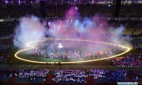 The heart is burned into the ground as the flag bearer wave the flags during the Closing Ceremony of the London 2012 Paralympic Games at the Olympic Stadium in London, Britain, on Sept. 9, 2012. (Xinhua/Li Jundong) 