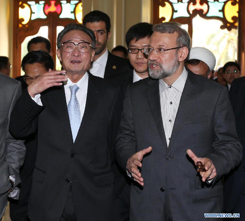 Wu Bangguo (L front), chairman of the Standing Committee of China's National People's Congress, chats with Iranian Parliament Speaker Ali Larijani during their talks in Tehran, Iran, Sept. 10, 2012. (Xinhua/Liu Weibing) 