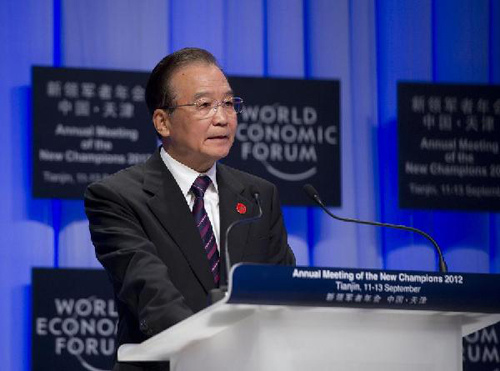 Chinese Premier Wen Jiabao addresses the opening ceremony of the World Economic Forum Annual Meeting of the New Champions 2012, also known as the Summer Davos Forum, in Tianjin, north China, Sept. 11, 2012. (Xinhua/Huang Jingwen)