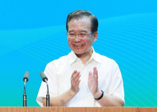 Chinese Premier Wen Jiabao smiles while delivering a speech in Tsinghua University in Beijing, capital of China, Sept. 14, 2012. Wen paid a visit to Tsinghua University Friday. (Xinhua/Ju Peng)