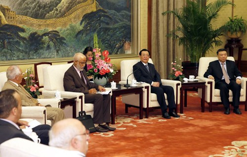 Wang Gang (2nd R), vice chairman of the National Committee of the Chinese People's Political Consultative Conference, meets with an Arab delegation led by Mohamed Yatim, a senior official of the Justice and Development Party of Morocco and vice president of the Moroccan Chamber of Representatives, in Beijing, capital of China, Sept. 18, 2012. (Xinhua/Ju Peng)