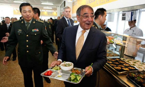 US Defense Secretary Leon Panetta carries his lunch tray before eating with cadets at the People's Liberation Army Engineering Academy in Beijing on Wednesday. Larry Downing / Agence France-Presse 