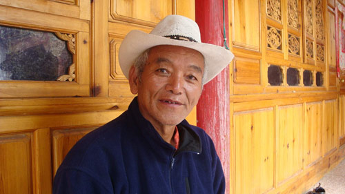 Sinaduji, 66, who used to be a poacher himself, is now the leader of an anti-poaching team in his village at the foot of Kawagarbo, Meili Snow Mountain's highest peak, in Yunnan province's Deqen county. (Photo: China Daily)