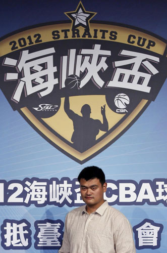 Yao Ming, former NBA basketball player and the owner of Shanghai Dongfang Sharks basketball team, attends a news conference for the 2012 Straits Cup basketball tournament in Taipei, Oct 12, 2012. [Photo/Agencies]
