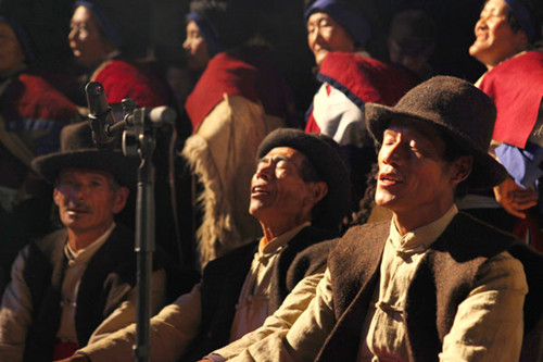 Huayin villagers perform traditional Naxi songs and dances at the Co-Art Festival in Shuhe Old Town in Yunnan province's Lijiang. PHOTO BY HU YUANJUN / FOR CHINA DAILY