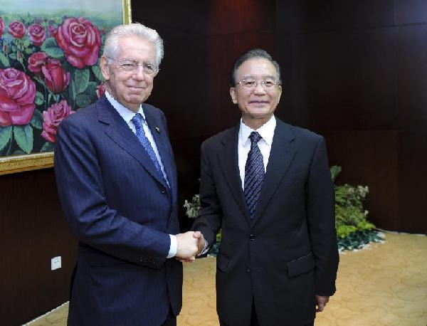 Chinese Premier Wen Jiabao (R) meets with Italian Prime Minister Mario Monti in Lao capital of Vientiane on Nov. 5, 2012. They were in Vientiane to attend the 9th Asia-Europe Meeting (ASEM) Summit opened on Monday. (Xinhua/Zhang Duo)