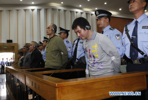 Naw Kham (1st R, front), principal suspect accused in the Mekong River murder case, and five accomplices hear their verdicts at court in Kunming, capital of southwest China's Yunnan Province, Nov. 6, 2012. Naw Kham was sentenced to death on Nov. 6. The 13 Chinese sailors were murdered after two cargo ships, the Hua Ping and Yu Xing 8, were hijacked on Oct. 5, 2011 on the Mekong River, an important waterway in Southeast Asia. (Xinhua/Wang Shen)