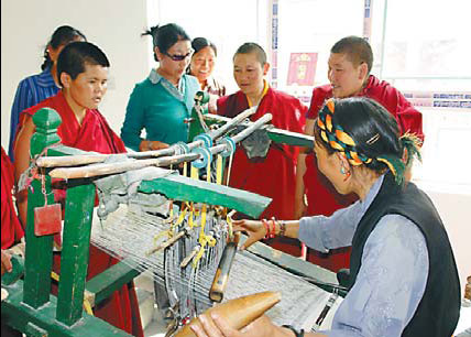 Tibetan women attend a training program to improve their weaving skills at Bainang county, Xigaze prefecture, Tibet. Provided to China Daily