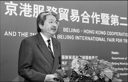 Financial Secretary John Tsang speaks at the symposium on the prospects for Beijing-Hong Kong cooperations on Tuesday. [Photo/China Daily] 