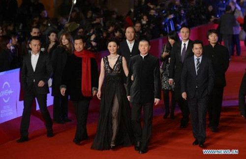 Chinese producer Wang Zhonglei, director Feng Xiaogang, actress Xu Fan and actor Zhang Guoli (R-L) walk on the red carpet of the 7th Rome Film Festival in Rome, Italy, Nov. 9, 2012. The 7th Rome Film Festival opened late Friday. Feng's Back to 1942 was announced the first of two surprise films that will screen in competition at the 7th Rome Film Festival. (Xinhua/Wang Qingqin)