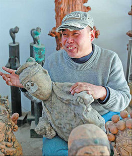 Dou Jinjun surrounded by his clay sculptures in his Songzhuang studio. Photos by Feng Yongbin / China Daily 