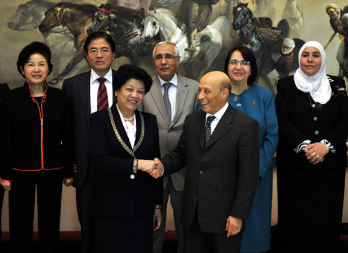 Chen Zhili (L Front), vice chairwoman of the Standing Committee of China's National People's Congress and president of the All-China women's Federation, shakes hands with Mohamed-Larbi Ould Khelifa, speaker of the National Assembly of Algeria, after their