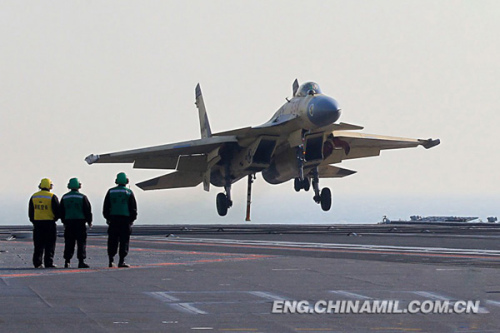 Recently, China's independently-developed carrier-borne J-15 fighters conducted test flights on such subjects as the landing with arresting cable and the ski-jump takeoff on the Liaoning aircraft carrier. As a China's independently-developed carrier-borne multi-purpose-type fighter, the J-15 fighter can carry various types of precision-guided weapons with long-range attack and round-the-clock fighting capacities. (chinamil.com.cn/ Li Tang)